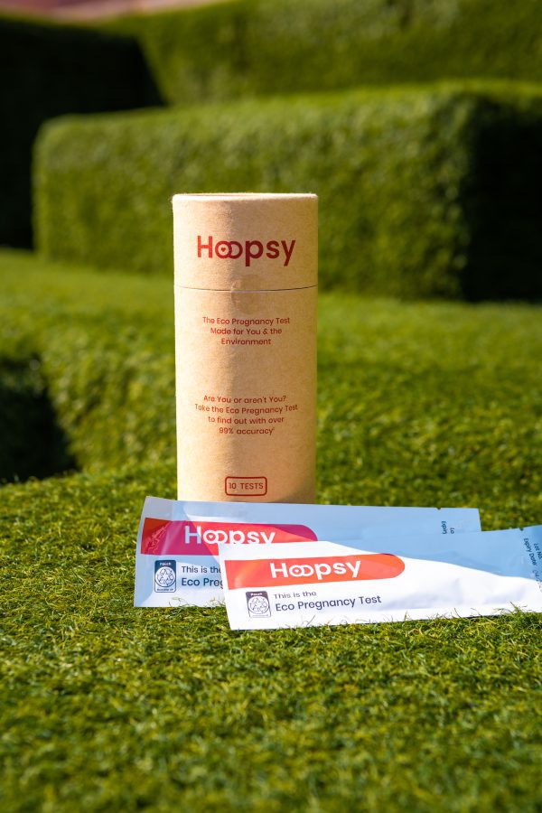 Hoopsy eco pregnancy test pack on the grass