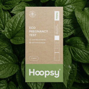 Hoopsy Eco-Friendly Pregnancy Test on a green leafy background